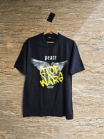 تیشرت مشکی مردانه، تیشرت نخ پنبهای، تیشرت مردانه نخ پنبه، تیشرت Stop War، تیشرت طرحدار مردانه، لباس با پیام اجتماعی، تیشرت خیابانی مردانه، تیشرت اسپرت مشکی، تیشرت راحتی مردانه، تیشرت با چاپ سفید، تیشرت با پیام ضد جنگ، تیشرت مردانه ساده، تیشرت پنبهای مشکی، خرید تیشرت مشکی مردانه، خرید اقساطی لباس مردانه، خرید با اسنپپی، تیشرت فری سایز، تیشرت مینیمال، پوشاک مردانه مدرن، تیشرت جدید مردانه